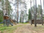 Участок у озера с постройкой